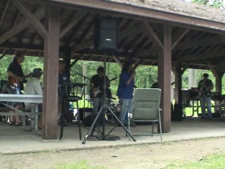 Claudette sings and introduces musicians...
